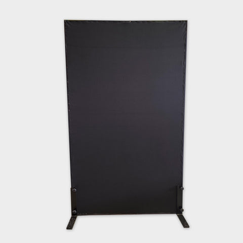 A large vertical black privacy screen with metal feet.