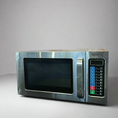 A silver Apuro commercial microwave oven with a digital display and control panel visible.