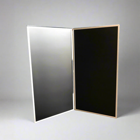 Two-panel black kitchen screen with a silver metal frame, standing against a white background.
