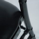 Detail of Black resin banquet chair