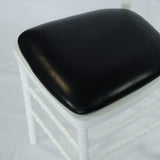 Detail of white resin banquet chair with cushion
